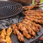 Cleaning the grates of an outdoor barbecue grill